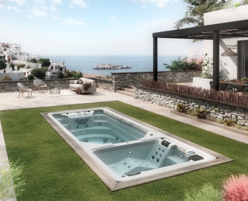 Swim spa Twin, con dos habitaculos preparadaos para el hidromasaje en una terraza con bonitas vistas al mar